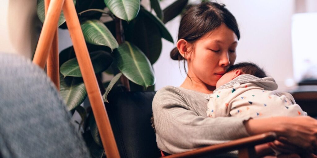 mom holding baby