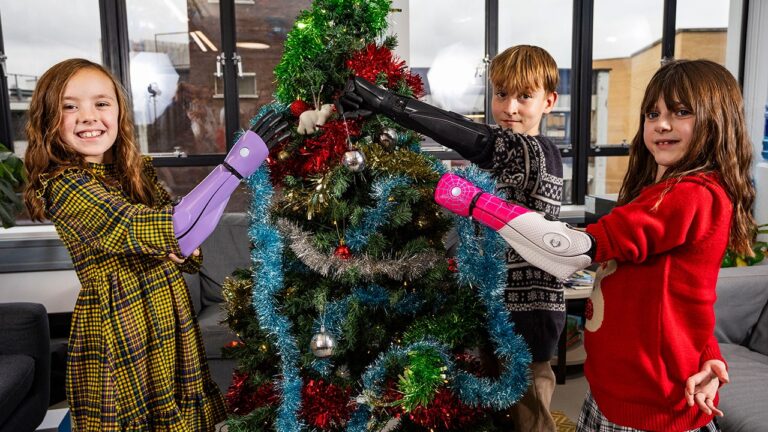 three kids with bionic arm