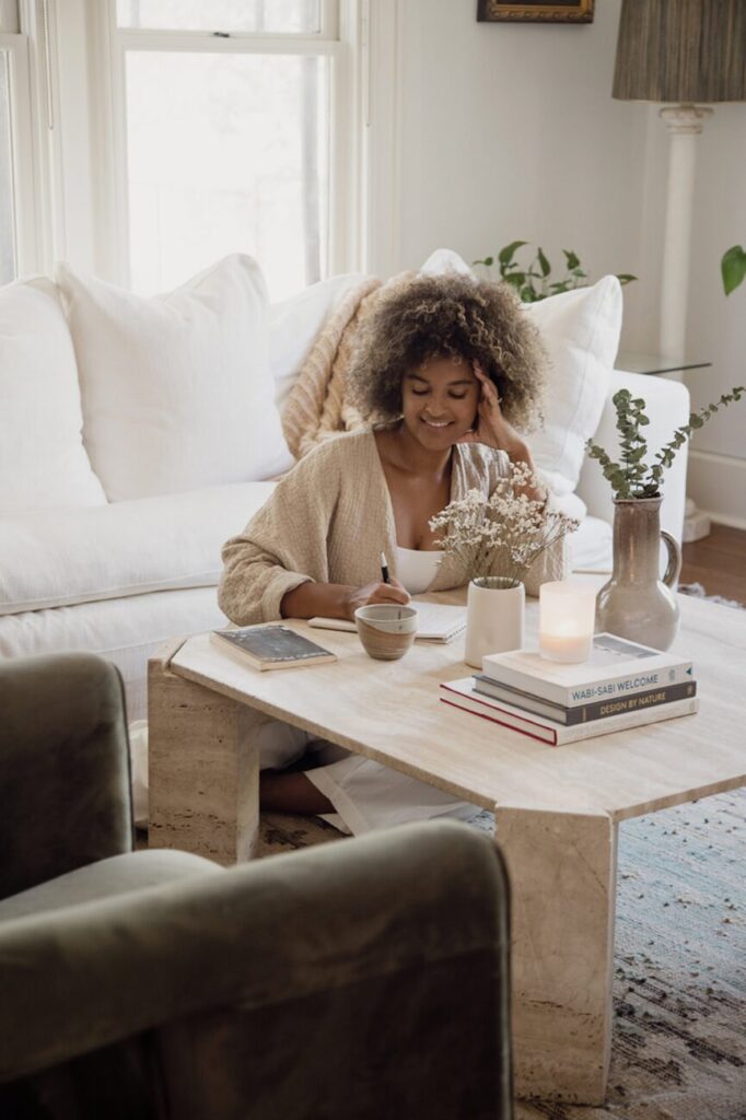 woman journaling living room 865x1298